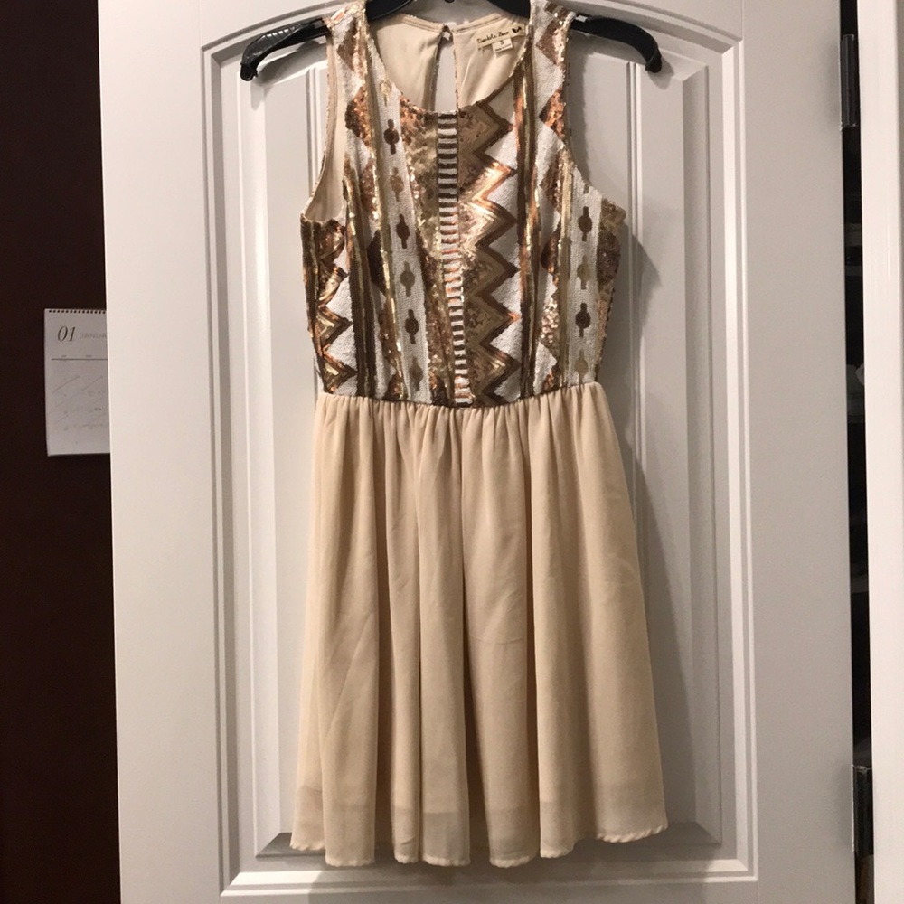 Cream dress with tan and brown sequins on top